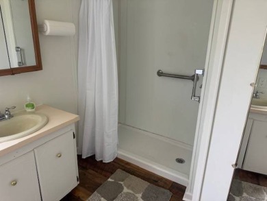 Welcome home to this lovely 2-bedroom, 2-bath oasis in the 55+ on Lake Henry Golf Club in Florida - for sale on GolfHomes.com, golf home, golf lot
