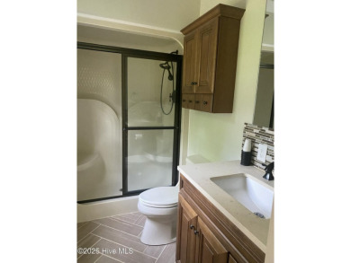 Experience the essence of coastal living in this well maintained on The Country Club of the Crystal Coast in North Carolina - for sale on GolfHomes.com, golf home, golf lot