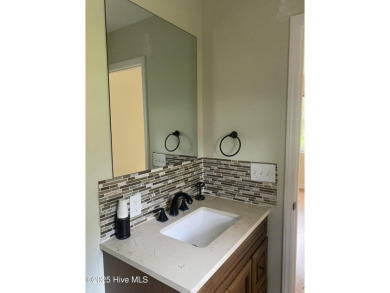 Experience the essence of coastal living in this well maintained on The Country Club of the Crystal Coast in North Carolina - for sale on GolfHomes.com, golf home, golf lot