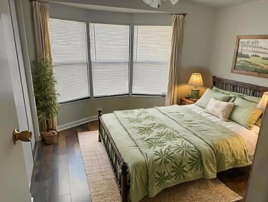 Welcome home to this lovely 2-bedroom, 2-bath oasis in the 55+ on Lake Henry Golf Club in Florida - for sale on GolfHomes.com, golf home, golf lot