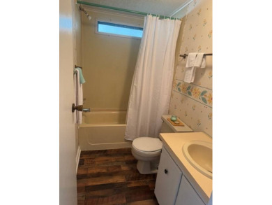 Welcome home to this lovely 2-bedroom, 2-bath oasis in the 55+ on Lake Henry Golf Club in Florida - for sale on GolfHomes.com, golf home, golf lot
