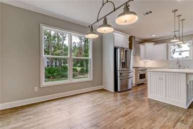 This stunning two-story home by renowned local builder Josselyn on Laurel Island Links in Georgia - for sale on GolfHomes.com, golf home, golf lot