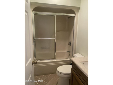 Experience the essence of coastal living in this well maintained on The Country Club of the Crystal Coast in North Carolina - for sale on GolfHomes.com, golf home, golf lot