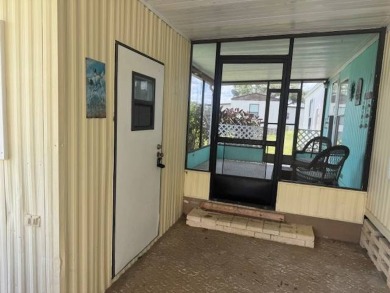 Welcome home to this lovely 2-bedroom, 2-bath oasis in the 55+ on Lake Henry Golf Club in Florida - for sale on GolfHomes.com, golf home, golf lot