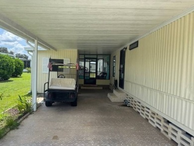 Welcome home to this lovely 2-bedroom, 2-bath oasis in the 55+ on Lake Henry Golf Club in Florida - for sale on GolfHomes.com, golf home, golf lot