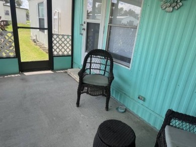 Welcome home to this lovely 2-bedroom, 2-bath oasis in the 55+ on Lake Henry Golf Club in Florida - for sale on GolfHomes.com, golf home, golf lot