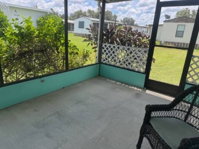 Welcome home to this lovely 2-bedroom, 2-bath oasis in the 55+ on Lake Henry Golf Club in Florida - for sale on GolfHomes.com, golf home, golf lot