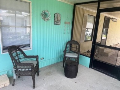 Welcome home to this lovely 2-bedroom, 2-bath oasis in the 55+ on Lake Henry Golf Club in Florida - for sale on GolfHomes.com, golf home, golf lot