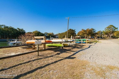 Experience the essence of coastal living in this well maintained on The Country Club of the Crystal Coast in North Carolina - for sale on GolfHomes.com, golf home, golf lot