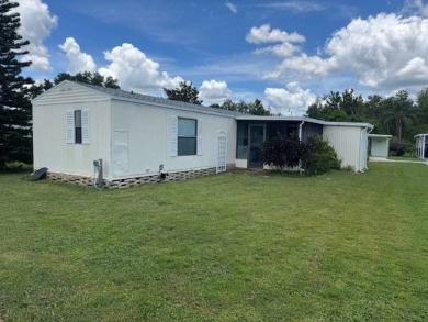 Welcome home to this lovely 2-bedroom, 2-bath oasis in the 55+ on Lake Henry Golf Club in Florida - for sale on GolfHomes.com, golf home, golf lot
