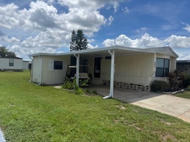 Welcome home to this lovely 2-bedroom, 2-bath oasis in the 55+ on Lake Henry Golf Club in Florida - for sale on GolfHomes.com, golf home, golf lot