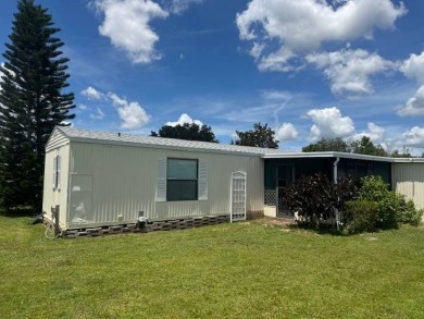 Welcome home to this lovely 2-bedroom, 2-bath oasis in the 55+ on Lake Henry Golf Club in Florida - for sale on GolfHomes.com, golf home, golf lot