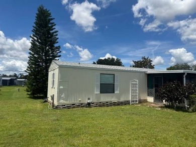 Welcome home to this lovely 2-bedroom, 2-bath oasis in the 55+ on Lake Henry Golf Club in Florida - for sale on GolfHomes.com, golf home, golf lot