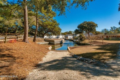 Experience the essence of coastal living in this well maintained on The Country Club of the Crystal Coast in North Carolina - for sale on GolfHomes.com, golf home, golf lot