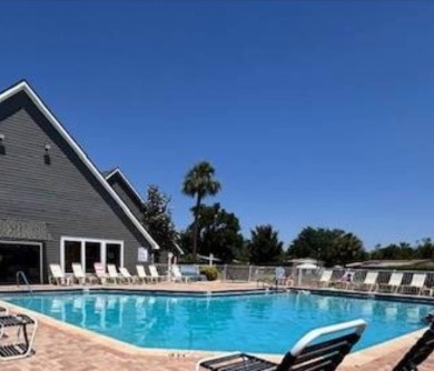 Welcome home to this lovely 2-bedroom, 2-bath oasis in the 55+ on Lake Henry Golf Club in Florida - for sale on GolfHomes.com, golf home, golf lot