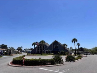 Welcome home to this lovely 2-bedroom, 2-bath oasis in the 55+ on Lake Henry Golf Club in Florida - for sale on GolfHomes.com, golf home, golf lot