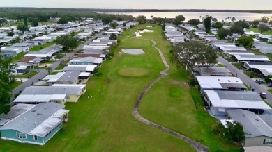 Welcome home to this lovely 2-bedroom, 2-bath oasis in the 55+ on Lake Henry Golf Club in Florida - for sale on GolfHomes.com, golf home, golf lot