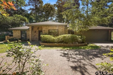 Nestled among mature trees, this charming 3 bedroom, 2 bath home on Hide-A-Way Lake Golf Course in Texas - for sale on GolfHomes.com, golf home, golf lot