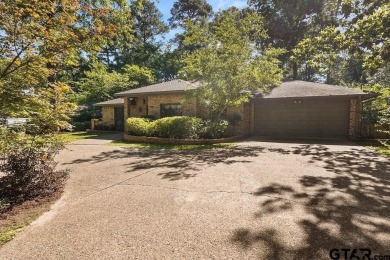 Nestled among mature trees, this charming 3 bedroom, 2 bath home on Hide-A-Way Lake Golf Course in Texas - for sale on GolfHomes.com, golf home, golf lot