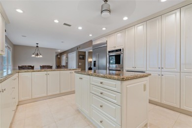 Step into timeless elegance in this stunning Colonial-style on Feather Sound Country Club in Florida - for sale on GolfHomes.com, golf home, golf lot