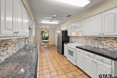 Nestled among mature trees, this charming 3 bedroom, 2 bath home on Hide-A-Way Lake Golf Course in Texas - for sale on GolfHomes.com, golf home, golf lot
