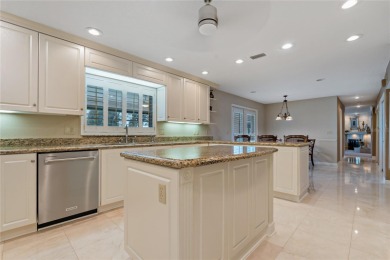 Step into timeless elegance in this stunning Colonial-style on Feather Sound Country Club in Florida - for sale on GolfHomes.com, golf home, golf lot