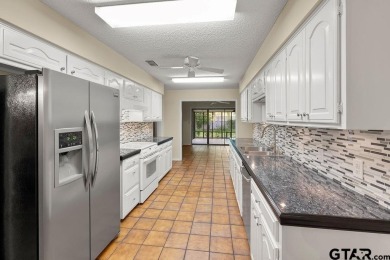 Nestled among mature trees, this charming 3 bedroom, 2 bath home on Hide-A-Way Lake Golf Course in Texas - for sale on GolfHomes.com, golf home, golf lot