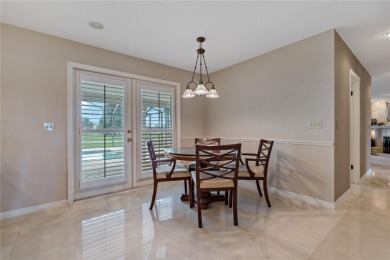 Step into timeless elegance in this stunning Colonial-style on Feather Sound Country Club in Florida - for sale on GolfHomes.com, golf home, golf lot