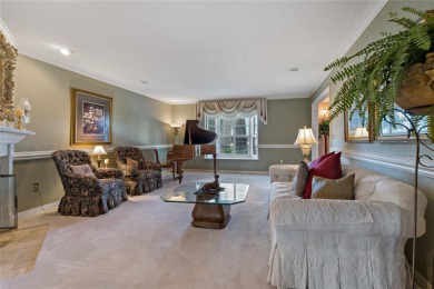 Step into timeless elegance in this stunning Colonial-style on Feather Sound Country Club in Florida - for sale on GolfHomes.com, golf home, golf lot