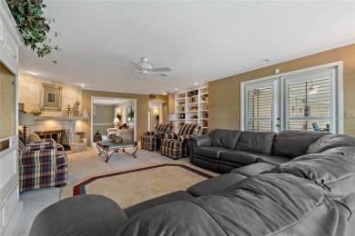 Step into timeless elegance in this stunning Colonial-style on Feather Sound Country Club in Florida - for sale on GolfHomes.com, golf home, golf lot