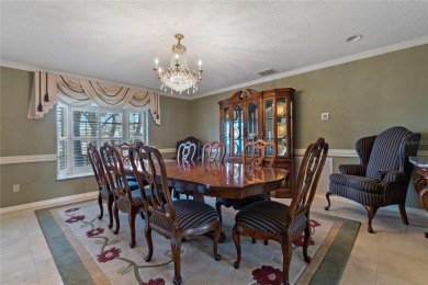 Step into timeless elegance in this stunning Colonial-style on Feather Sound Country Club in Florida - for sale on GolfHomes.com, golf home, golf lot