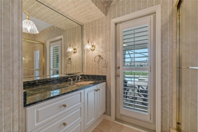 Step into timeless elegance in this stunning Colonial-style on Feather Sound Country Club in Florida - for sale on GolfHomes.com, golf home, golf lot