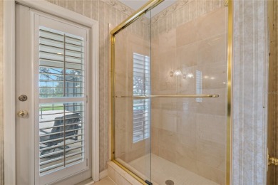 Step into timeless elegance in this stunning Colonial-style on Feather Sound Country Club in Florida - for sale on GolfHomes.com, golf home, golf lot