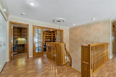Step into timeless elegance in this stunning Colonial-style on Feather Sound Country Club in Florida - for sale on GolfHomes.com, golf home, golf lot