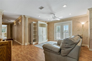 Step into timeless elegance in this stunning Colonial-style on Feather Sound Country Club in Florida - for sale on GolfHomes.com, golf home, golf lot