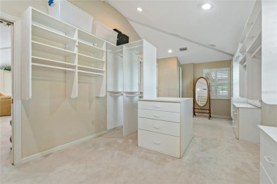 Step into timeless elegance in this stunning Colonial-style on Feather Sound Country Club in Florida - for sale on GolfHomes.com, golf home, golf lot