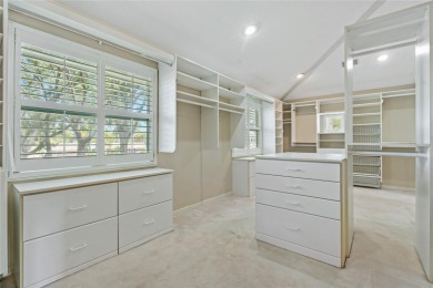 Step into timeless elegance in this stunning Colonial-style on Feather Sound Country Club in Florida - for sale on GolfHomes.com, golf home, golf lot