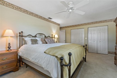 Step into timeless elegance in this stunning Colonial-style on Feather Sound Country Club in Florida - for sale on GolfHomes.com, golf home, golf lot