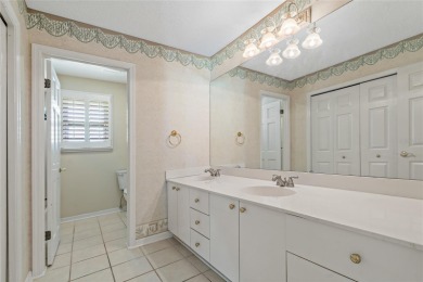 Step into timeless elegance in this stunning Colonial-style on Feather Sound Country Club in Florida - for sale on GolfHomes.com, golf home, golf lot