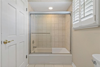 Step into timeless elegance in this stunning Colonial-style on Feather Sound Country Club in Florida - for sale on GolfHomes.com, golf home, golf lot