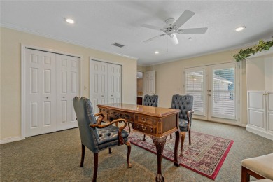 Step into timeless elegance in this stunning Colonial-style on Feather Sound Country Club in Florida - for sale on GolfHomes.com, golf home, golf lot
