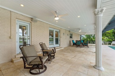 Step into timeless elegance in this stunning Colonial-style on Feather Sound Country Club in Florida - for sale on GolfHomes.com, golf home, golf lot