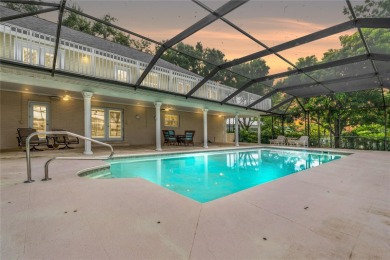 Step into timeless elegance in this stunning Colonial-style on Feather Sound Country Club in Florida - for sale on GolfHomes.com, golf home, golf lot