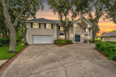 Step into timeless elegance in this stunning Colonial-style on Feather Sound Country Club in Florida - for sale on GolfHomes.com, golf home, golf lot
