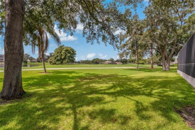 Step into timeless elegance in this stunning Colonial-style on Feather Sound Country Club in Florida - for sale on GolfHomes.com, golf home, golf lot