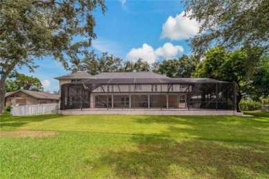 Step into timeless elegance in this stunning Colonial-style on Feather Sound Country Club in Florida - for sale on GolfHomes.com, golf home, golf lot