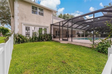 Step into timeless elegance in this stunning Colonial-style on Feather Sound Country Club in Florida - for sale on GolfHomes.com, golf home, golf lot