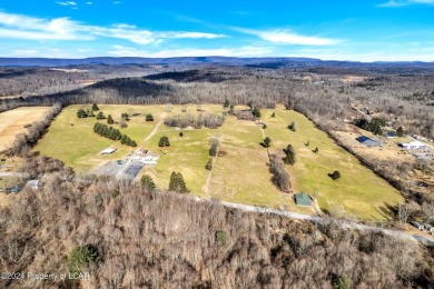 This spectacular property situated on 86 acres features a 9 hole on Morgan Hills in Pennsylvania - for sale on GolfHomes.com, golf home, golf lot