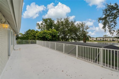 Step into timeless elegance in this stunning Colonial-style on Feather Sound Country Club in Florida - for sale on GolfHomes.com, golf home, golf lot