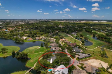 Step into timeless elegance in this stunning Colonial-style on Feather Sound Country Club in Florida - for sale on GolfHomes.com, golf home, golf lot